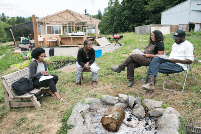 Multnomah County nutritionist Helen Kidane, left, joins REACH coordinator Charlene McGee for a visit to Mudbone Grown, where they sit down with farmers Shantae Johnson and Art Shaver