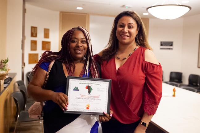 Candice Murphy poses with parole and probation officer Tomasina Tavai-Porotesano