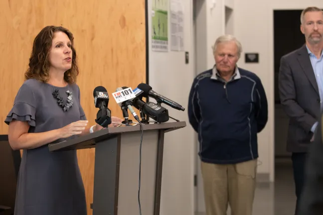 Chair Deborah Kafoury with Tim Boyle and Mayor Ted Wheeler at the River District Navigation Center on Aug. 26, 2019.