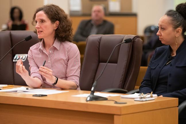 Health Officer Dr. Jennifer Vines, left, holds up a packet of JUUL e-cigarette flavors, alongside Public Health Director Rachael Banks at Sept. 2019 board meeting