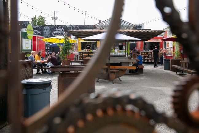 Food cart pods create community gathering spaces in otherwise vacant lots.