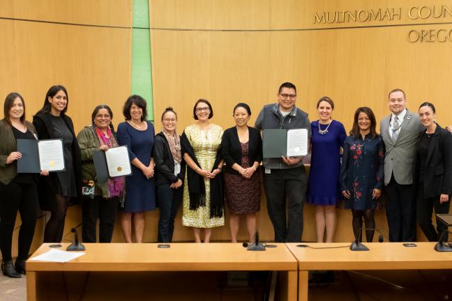 Multnomah County Board members and staff pose alongside Members of the Native American Youth and Family Center or NAYA