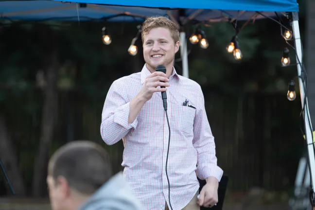 Caleb Coder, Eat & Greet creator, addresses the crowd during a welcoming party for the Wy'east shelter on Oct. 11, 2019.