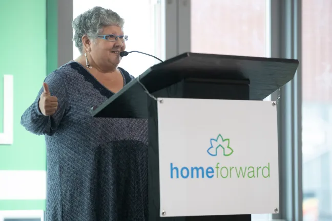 TomiRene Hettman, Home Forward resident and member of the authority's board, speaks at the opening of the Louisa Flowers Apartments on Nov. 14, 2019.