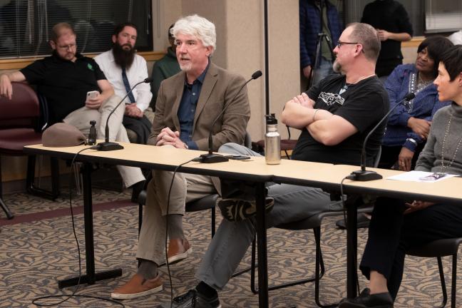 Vape shop owner Paul Bates, left, tells Board not to restrict sale of flavored e-liquids.