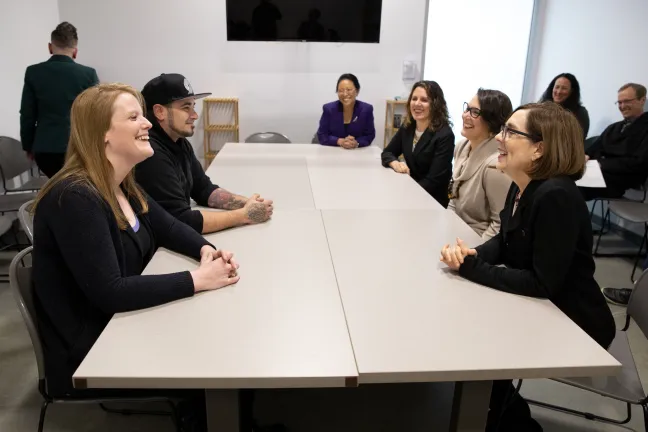 Commissioner Lori Stegmann, Chair Deborah Kafoury, Commissioner Jessica Vega Pederson and Gov. Kate Brown speak with shelter participants at the Laurelwood Center on Friday, Dec. 6, 2019.