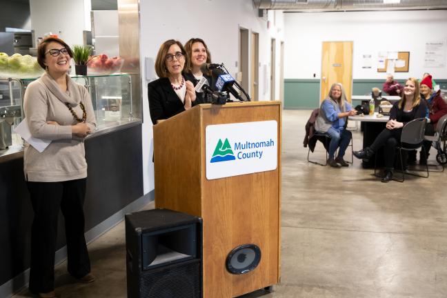 Commissioner Jessica Vega Pederson, Gov. Kate Brown and Chair Deborah Kafoury speaking at the Laurelwood Center on Friday, Dec. 6, 2019.