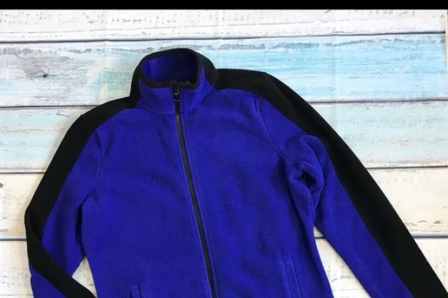 When found, the woman wore a medium blue Ralph Lauren Active fleece jacket with black trim.