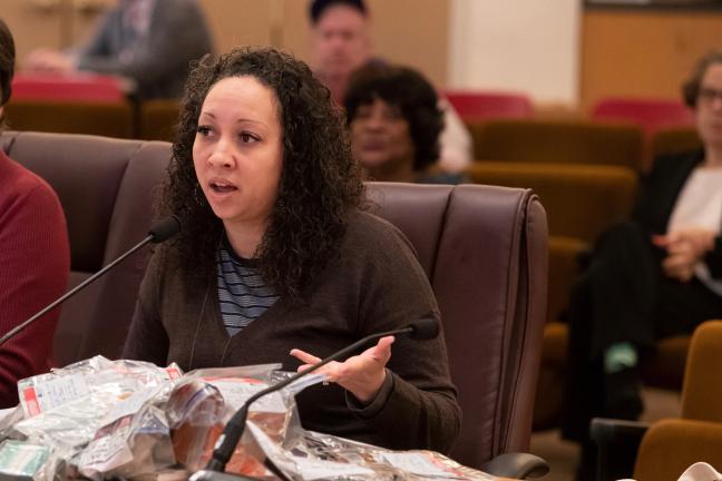 Public Health Director Rachael Banks displays a bag of evidence — flavored tobacco products illegally sold to youth.