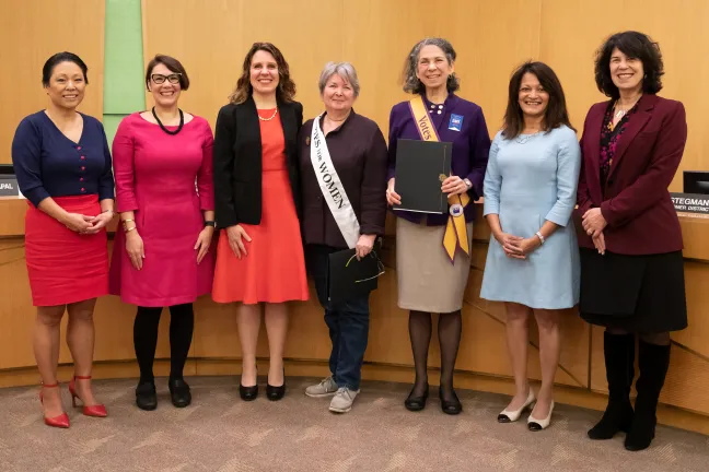 Board of County Commissioners pose with past and present board presidents of the League of Women Voters.
