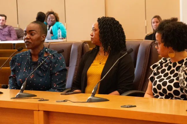 April Etuk addresses the board.