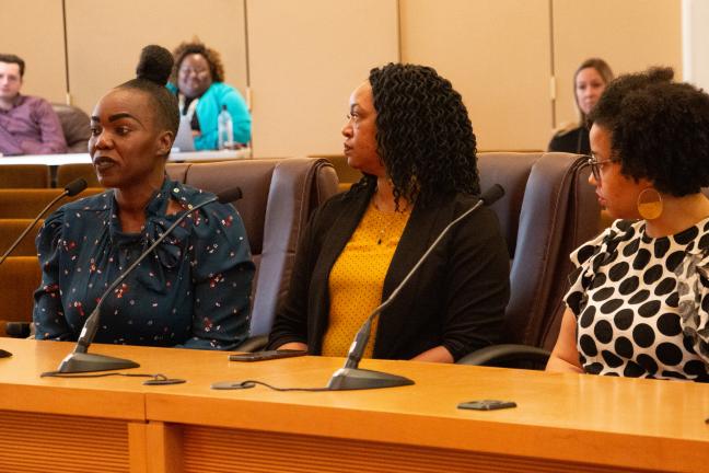 April Etuk addresses the board.