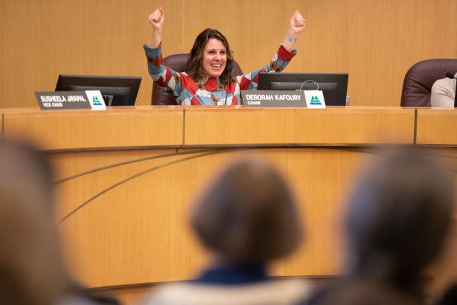 County Chair Deborah Kafoury raises her arms in support for proposed Library bond measure at March 5 briefing.