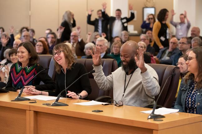 County Library Director Vailey Oehlke (left) smiles at colleague Perry Gardner during board briefing on Library bond.