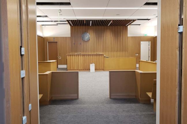 Wood paneling has been installed in a court room at new Central Courthouse.