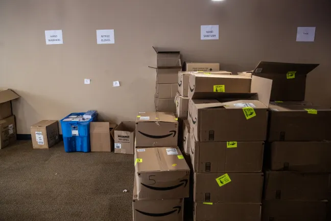 Gear, including hand sanitizer and water, waits to be picked up by outreach teams from the Joint Office's supply center downtown.