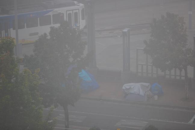 Smoke hovers over tents in Old Town in September 2020.