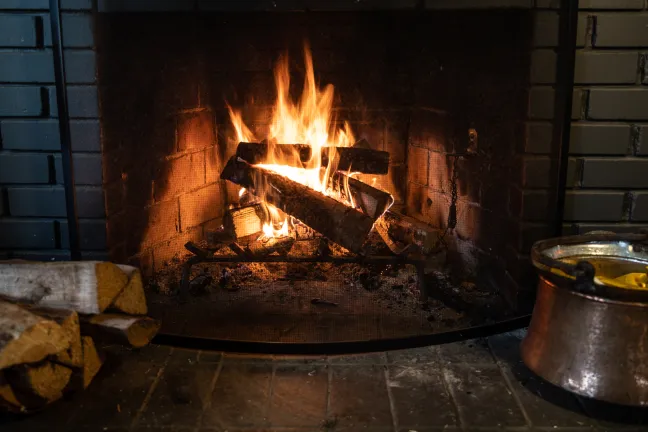 Wood burning in a fireplace.