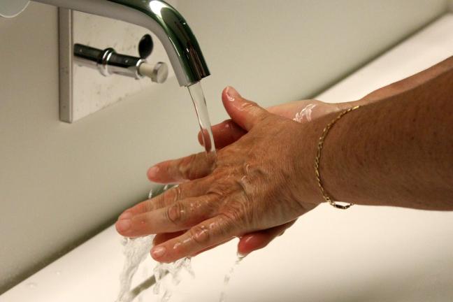 Close-up of person washing hands