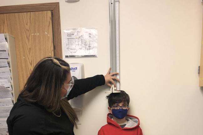 A child and health professional at the new Reynolds Student Health Center  