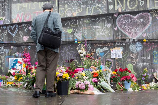 Wall of heros created after 2017 MAX killings. Murder occurred after assailant shouted racial slurs at two African-American women.