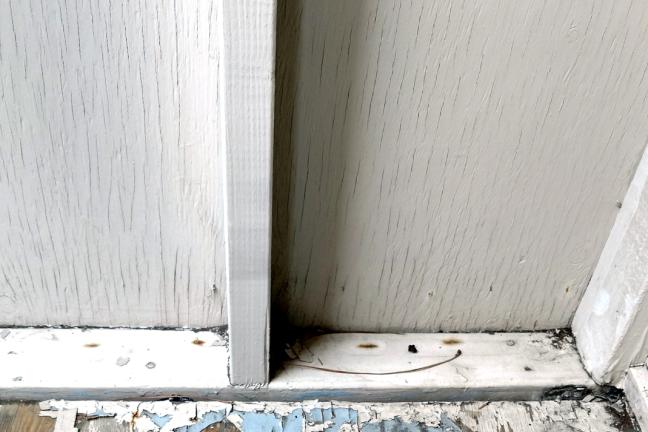 Lead paint can hide under rugs and in corners, like on this covered porch in Portland