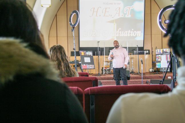 H.E.A.T. graduates listen to speakers at ceremony celebrating completion of the 9-month curriculum.   