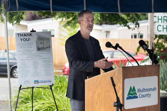 Mayor Ted Wheeler speaks during a ceremony to thank supporters of the St. Johns Village on May 21, 2021.