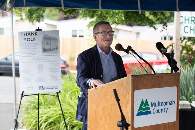 City Commissioner Dan Ryan speaks during a ceremony to thank supporters of the St. Johns Village on May 21, 2021.