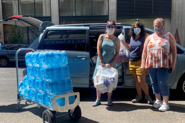 From right, JOHS coordinator Celeste Duvall, Commissioner Sharon Meieran and Rep. Lisa Reynolds outside the JOHS supply center on Sunday, June 27, 2021.