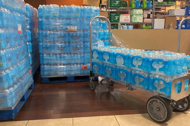 Water at the JOHS' supply center awaits pickup by outreach teams on Friday, June 25.