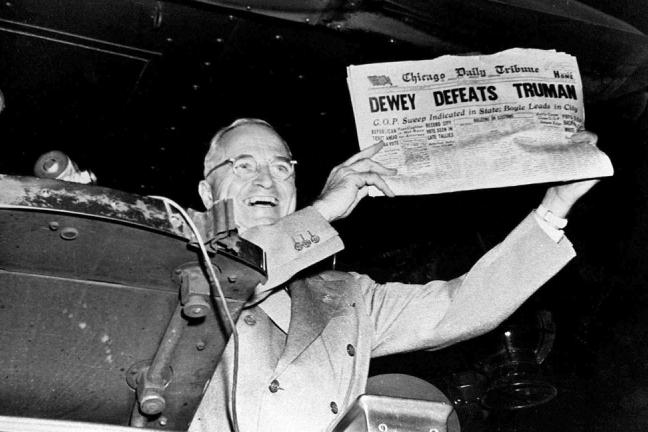 Black and white photograph of President-elect Harry S. Truman holding an early edition of the November 4, 1948 Chicago Tribune mistakenly announcing Dewey's victory.