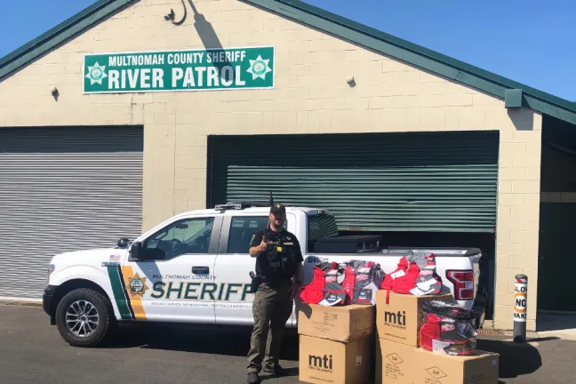Multnomah County Sheriff's Office employee with donation of life vests