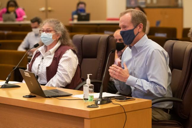 Toni Weiner, left, and Marc Jolin, Joint Office director, brief the Board on plans for the Arbor Lodge shelter on Nov. 18, 2021.