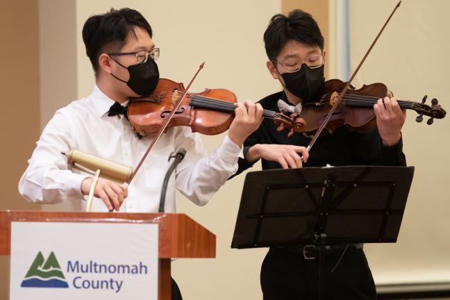 Brothers Tim and Paul Lee perform Korean folk songs on their violins