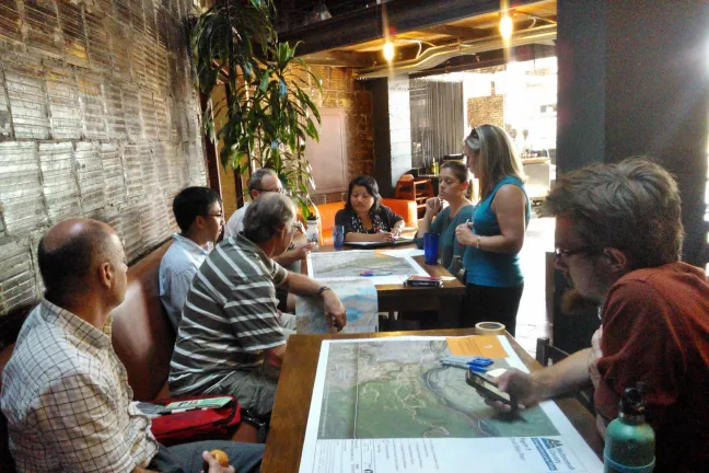 Members of the Multnomah County Bicycle and Pedestrian Citizen Advisory Committee huddled around maps to provide input on bicycle routes throughout rural Multnomah County.