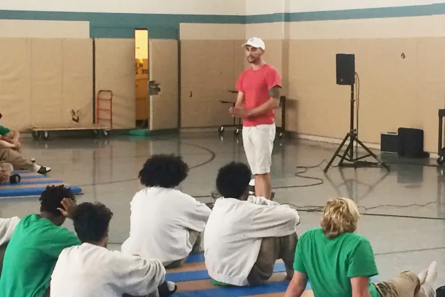 Noah Schultz talking to youth