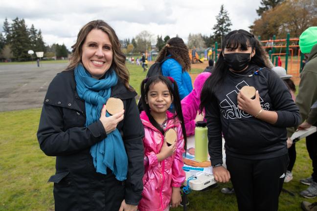 Chair Kafoury and students counted tree rings on "tree cookies.''