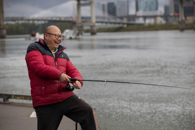 Dan Yan, a local fisherman, fishing on the East side of the Lower Willamette River.