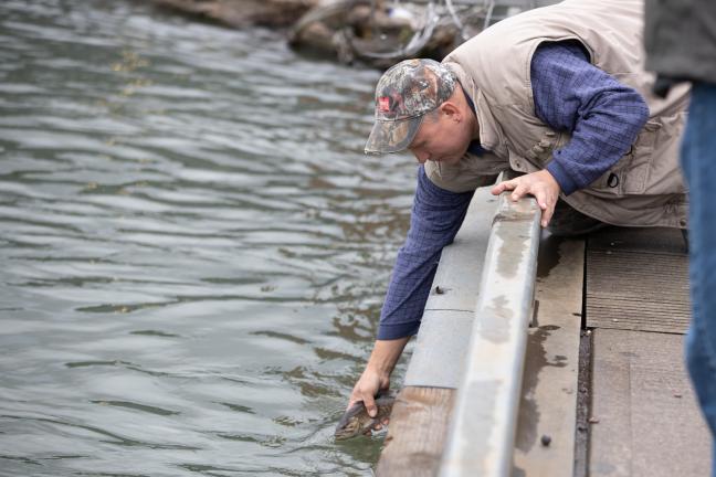 Yevgeniy Ruban catches and releases fish in the Lower Willamette River on April 19, 2022.