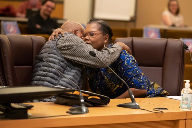 Billy Anfield, an Advocacy Coordinator for Central City Concern hugs Erika Preuitt, director of Multnomah County's Department of Community Justice.