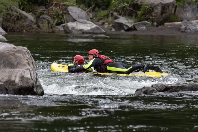 Program lifeguards demonstrate a river rescue.
