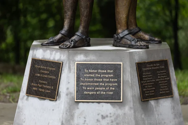 Plaques honor the rescue program founders and contributors to the sculpture by Caswell Sculpture.