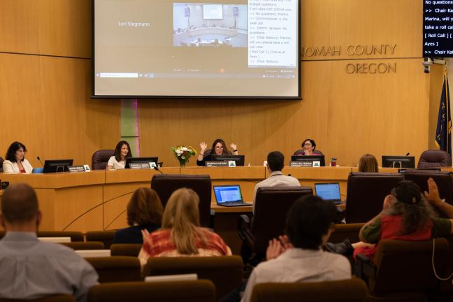 Chair Deborah Kafoury, board members and staff cheer as the Board approves the $3.3 billion budget.