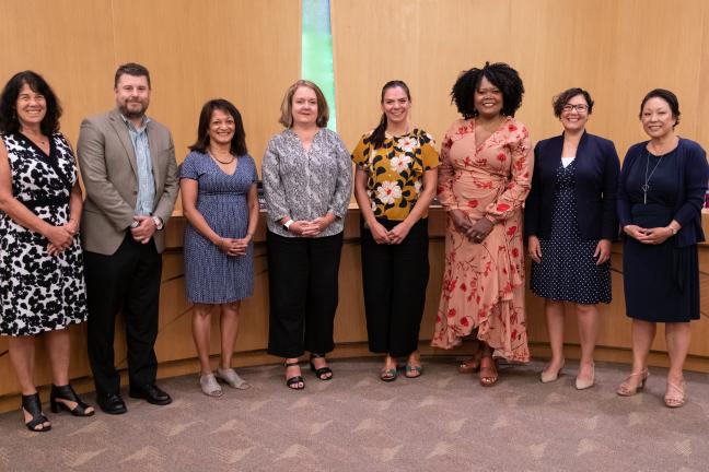 Members of the Multnomah County Board of Commissioners pose with the County's Department of Community Justice executive leadership team for Pretrial, Probation and Parole Supervision Week.