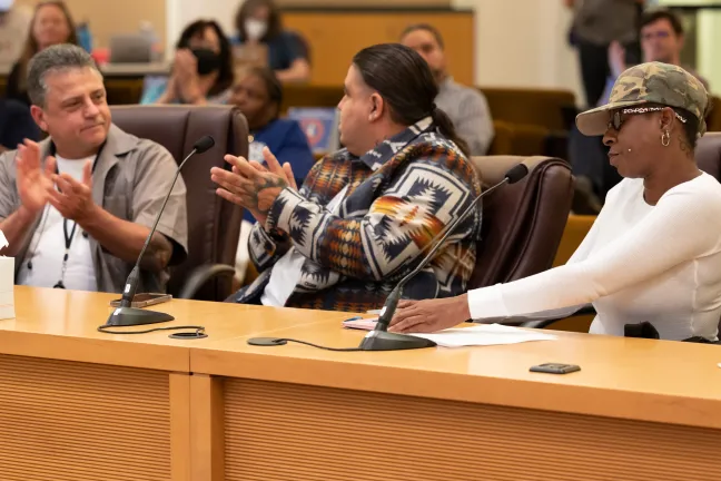 (Left to right): Mario Cardenas, Jerrod Murray, and Coretta King testify before the Board of Commissioners