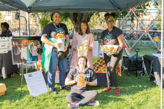 Commissioner Susheela Jayapal poses at Reclaiming Black Joy booth. 