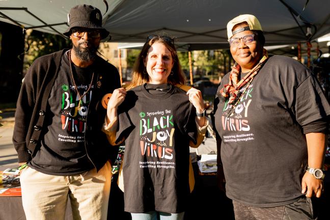 Chair Deborah Kafoury holds up Spreading Black Joy Virus shirt at Reclaiming Black Joy event in North Portland.