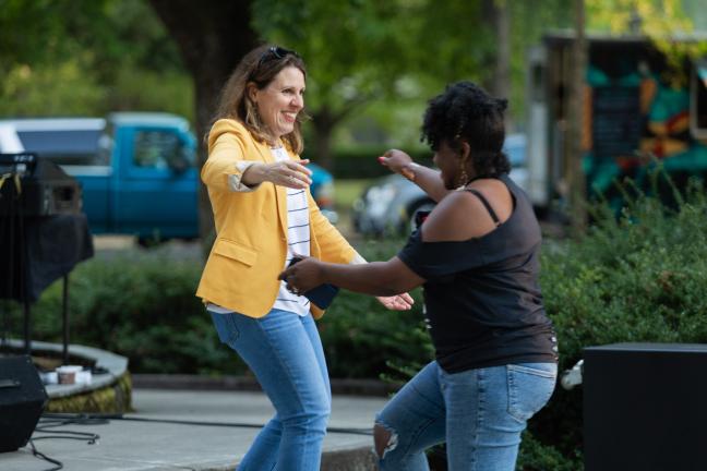 Chair Deborah Kafoury hugs Health Department Director Ebony Clarke at "Reclaiming Black Joy" event. 