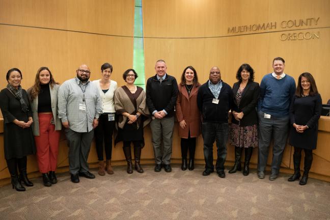 The Multnomah County Board of Commissioners pose with Multnomah County Election employees for Election Hero Day Proclamation.